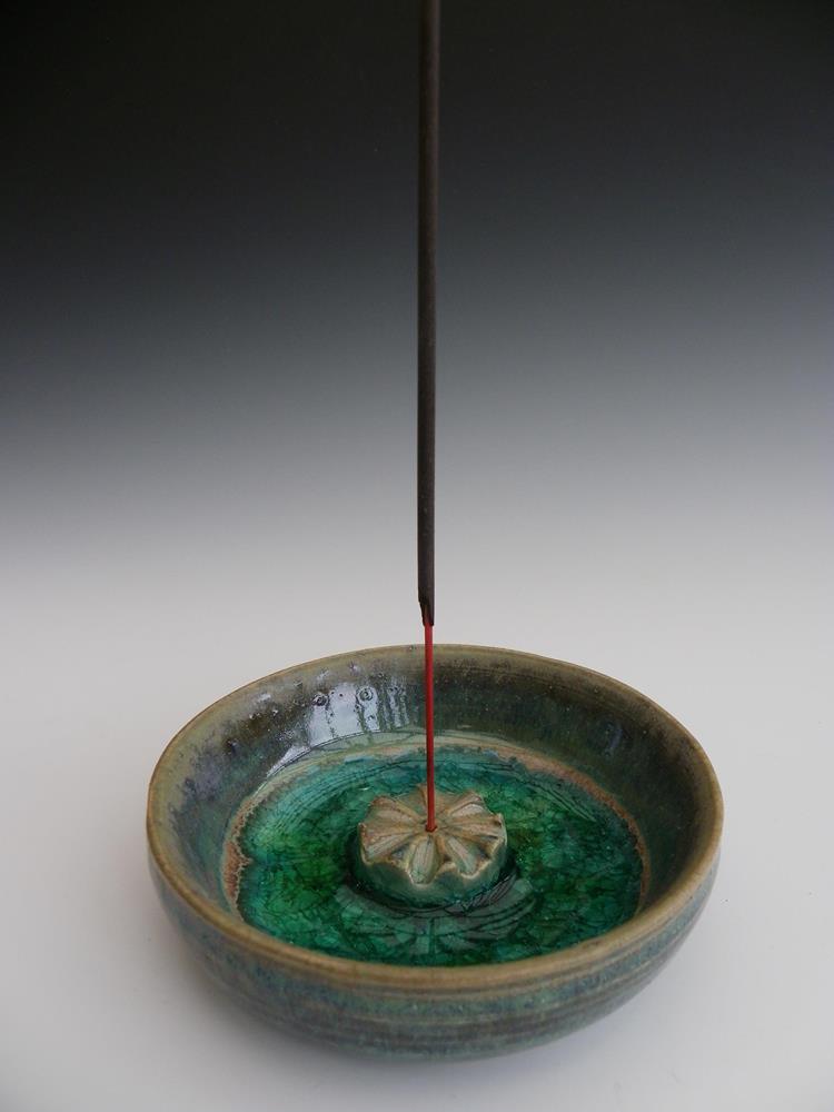 Incense stick holder.
Inspired by poppy seed head.